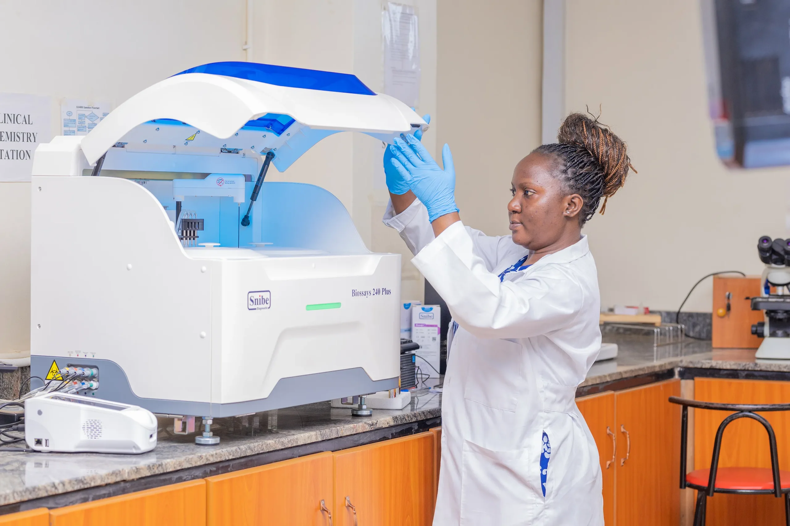 doctor using an x-ray machine in medical clinic in kampala